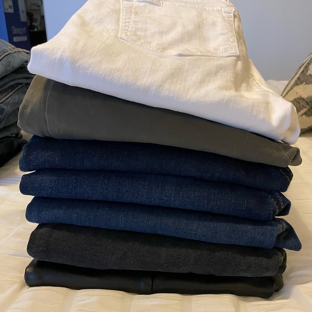7 pairs of LOFT skinny jeans/ 1 pair of faux leather leggings .